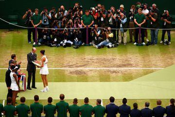 LONDON, ENGLAND - JULY 15: Runner-up Venus Williams of The United States looks on as Garbine Muguruza of Spain is presented with the winners trophy by The Duke of Kent after the Ladies Singles final against on day twelve of the Wimbledon Lawn Tennis Championships at the All England Lawn Tennis and Croquet Club at Wimbledon on July 15, 2017 in London, England.