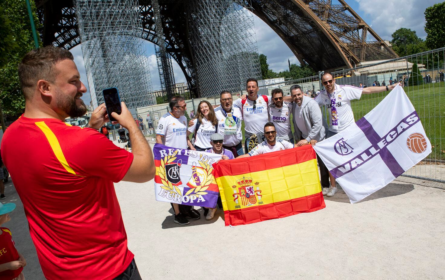Real Madrid fans pose for photographs by the Eiffel Tower ahead of the Champions League final in Paris.