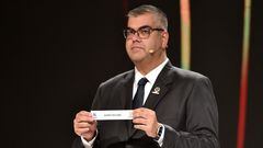 Conmebol's Director of Clubs Competitions Frederico Nantes shows the slip of Argentina's Godoy Cruz during the Copa Libertadores draw at Conmebol's headquarters in Luque, Paraguay on December 19, 2023. (Photo by NORBERTO DUARTE / POOL / AFP)