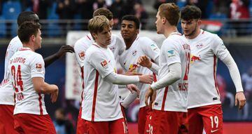 Leipzig players celebrate after the German First division Bundesliga football match between RB Leipzig and SC Freiburg in Leipzig, eastern Germany, on April 15, 2017