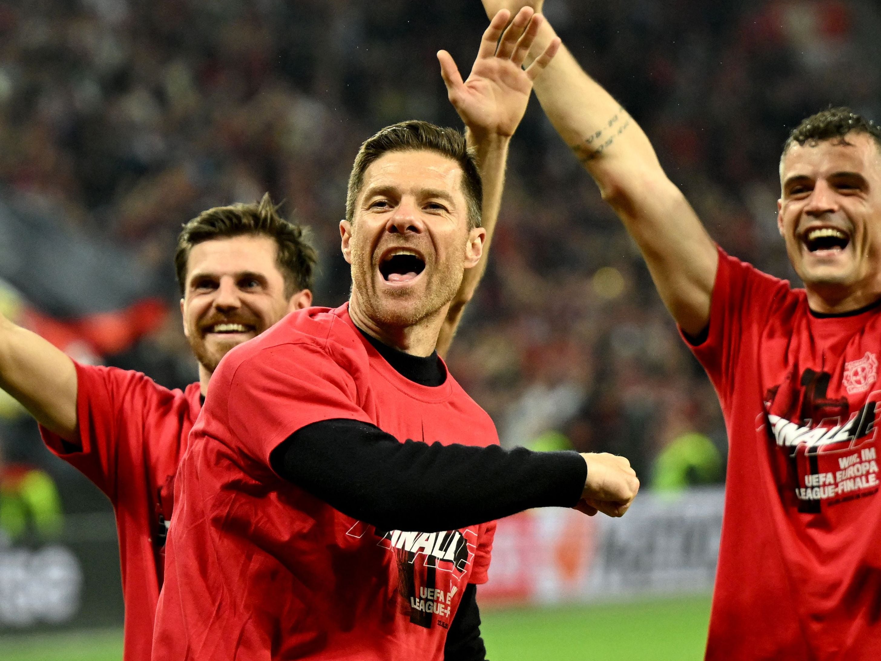 Bayer Leverkusen's Spanish head coach Xabi Alonso (C) celebrates after the UEFA Europa League semi final second leg football match between Bayer Leverkusen and ASC Roma in Leverkusen, on May 9, 2024. (Photo by INA FASSBENDER / AFP)