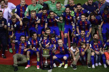 Aim to retain | Barcelona players and staff pose with the Copa del Rey trophy at the Vicente Calderon stadium in Madrid on May 27, 2017.