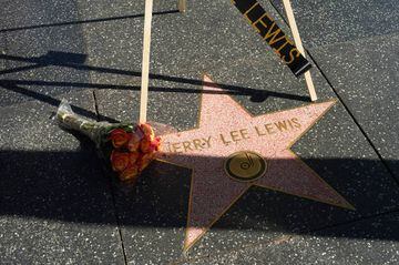 HOLLYWOOD, CALIFORNIA - OCTOBER 28: Flowers are placed on Jerry Lee Lewis' star on the Hollywood Walk of Fame on October 28, 2022 in Hollywood, California. Lewis passed away at his home in Memphis, Tennessee on Friday, October 28, 2022 at the age of 87.  (Photo by Unique Nicole/Getty Images)