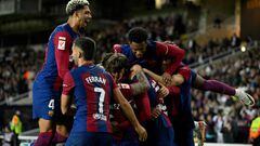 Barcelona's Spanish forward #38 Marc Guiu celebrates with teammates after scoring his team's first goal during the Spanish league football match between FC Barcelona and Athletic Club Bilbao at the Estadi Olimpic Lluis Companys in Barcelona on October 22, 2023. (Photo by Josep LAGO / AFP)