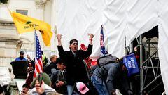 A man, identified as Ryan Kelley in a sworn statement by an FBI agent, gestures as supporters of U.S. President Donald Trump make their way past barriers at the U.S. Capitol during a protest against the certification of the 2020 U.S. presidential election results by the U.S. Congress, in Washington, U.S., January 6, 2021. REUTERS/Jim Urquhart