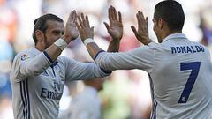 Real Madrid&#039;s Welsh forward Gareth Bale (L) and Real Madrid&#039;s Portuguese forward Cristiano Ronaldo celebrate after scoring a goal during the Spanish league football match Real Madrid CF vs SD Eibar at the Santiago Bernabeu stadium in Madrid on O
