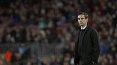 Valencia coach Gary Neville looks on during his side&#039;s thumping at Barcelona.
