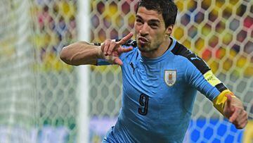 Uruguay's Luis Suarez celebrates after scoring against Brazil during their Russia 2018 FIFA World Cup South American Qualifiers' football match, in Recife, northeastern Brazil, on March 25, 2016.