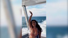 Singer Selena Gomez is living her best life this summer, which shows in this video of her singing “Calm Down” and dancing carefree on a boat.