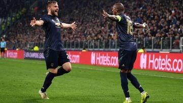 TURIN, ITALY - NOVEMBER 07:  Ashley Young of Manchester United celebrates his sides second goal which came through a Alex Sandro of Juventus (not pictured) own goal with Luke Shaw of Manchester United during the UEFA Champions League Group H match between