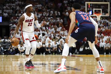 Miami Heat forward Jimmy Butler (22) dribbles the basketball as Philadelphia 76ers forward Tobias Harris (12) 