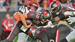 TAMPA, FLORIDA - DECEMBER 18: Logan Wilson #55 of the Cincinnati Bengals forces a fumble by Tom Brady #12 of the Tampa Bay Buccaneers during the third quarter at Raymond James Stadium on December 18, 2022 in Tampa, Florida. (Photo by Julio Aguilar/Getty Images)