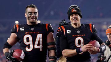 CINCINNATI, OHIO - JANUARY 15: Sam Hubbard #94 and Joe Burrow #9 of the Cincinnati Bengals celebrate as they walk off the field after defeating the Baltimore Ravens in the AFC Wild Card playoff game at Paycor Stadium on January 15, 2023 in Cincinnati, Ohio. The Cincinnati Bengals defeated the Baltimore Ravens with a score of 24 to 17.   Dylan Buell/Getty Images/AFP (Photo by Dylan Buell / GETTY IMAGES NORTH AMERICA / Getty Images via AFP)