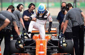 McLaren's Spanish driver Fernando Alonso steps out of his car after the third practice session of the Formula One Chinese Grand Prix in Shanghai.