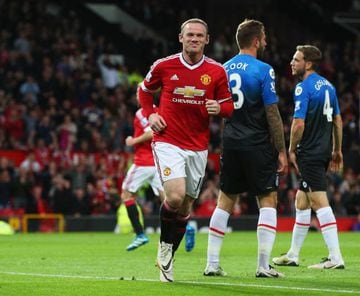 Rooney celebrates opening the scoring at Old Trafford.
