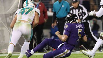 BALTIMORE, MD - OCTOBER 26: Quarterback Joe Flacco #5 of the Baltimore Ravens is hit by middle linebacker Kiko Alonso #47 of the Miami Dolphins as he slides in the second quarter against the Miami Dolphins at M&amp;T Bank Stadium on October 26, 2017 in Baltimore, Maryland.   Rob Carr/Getty Images/AFP == FOR NEWSPAPERS, INTERNET, TELCOS &amp; TELEVISION USE ONLY ==