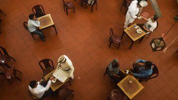Waiters serve customers at the Indian Coffee House after the establishment reopened following the eased restrictions imposed by authorities as a preventive measure against the spread of the COVID-19 coronavirus in Kolkata on July 2, 2020. (Photo by Dibyan