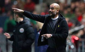 Pep Guardiola issues instructions to his Manchester City players.
