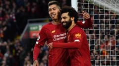 Liverpool&#039;s Egyptian midfielder Mohamed Salah (R) celebrates with Liverpool&#039;s Brazilian midfielder Roberto Firmino after scoring his team&#039;s third goal during the English Premier League football match between Liverpool and Southampton at Anf