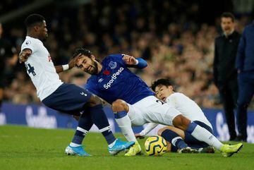 Everton's André Gomes sustains an injury in this action with Tottenham Hotspur's Serge Aurier and Son Heung-min.