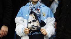 Manchester City fan with a Pep Guardiola scarf