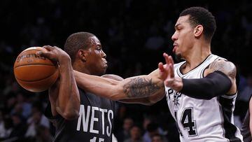 San Antonio Spurs guard Danny Green (14) knocks the ball away from Brooklyn Nets guard Isaiah Whitehead (15) during the first half of an NBA basketball game, Monday, Jan. 23, 2017, in New York. (AP Photo/Adam Hunger)