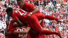 MUNICH, GERMANY - MAY 18:  Thiago (top), David Alaba and teammates of FC Bayern Muenchen celebrate Kingsley Coman&#039;s first goal during the Bundesliga match between FC Bayern Muenchen and Eintracht Frankfurt at Allianz Arena on May 18, 2019 in Munich, 