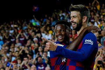 Barcelona's Ansu Fati and Gerard Piqué celebrate