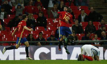 Spain's midfielder Isco celebrates scoring his team's second goal with Iago Aspas.