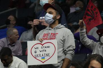 Feb 25, 2022; Charlotte, North Carolina, USA; A fan shows support for the Ukraine during the first quarter between the Charlotte Hornets and the Toronto Raptors at the Spectrum Center. Mandatory Credit: Jim Dedmon-USA TODAY Sports
