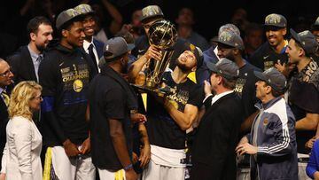 CLEVELAND, OH - JUNE 08: Stephen Curry #30 of the Golden State Warriors celebrates with the Larry O&#039;Brien Trophy after defeating the Cleveland Cavaliers during Game Four of the 2018 NBA Finals at Quicken Loans Arena on June 8, 2018 in Cleveland, Ohio