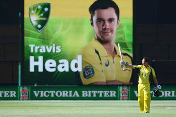 Travis Head gestures after scoring his maiden century in the one-day international cricket match between Australia and Pakistan.