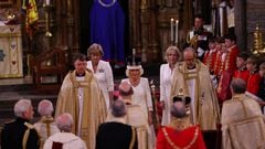 Viewers of the ceremony at Westminster Abbey may have noticed two women dressed in white assisting Queen Camilla while the Coronation was taking place