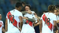 GOIANIA, BRAZIL - JUNE 20: Aldo Corzo (C) of Peru embraces with teammate Gianluca Lapadula after winning a group B match between Colombia and Peru as part of Copa America Brazil 2021 at Estadio Olimpico on June 20, 2021 in Goiania, Brazil. (Photo by Alexa