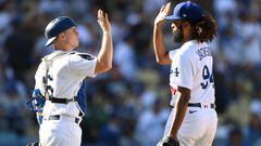 Oct 3, 2021; Los Angeles, California, USA; Los Angeles Dodgers catcher Will Smith (16) high fives with relief pitcher Andre Jackson (94) after the final out of the ninth inning against the Milwaukee Brewers at Dodger Stadium. Mandatory Credit: Jayne Kamin