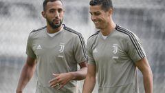 Medhi Benatia y Cristiano Ronaldo, con un ojo morado, entrenando con la Juventus.