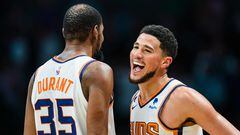 CHARLOTTE, NORTH CAROLINA - MARCH 01: Kevin Durant #35 celebrates with Devin Booker #1 of the Phoenix Suns in the fourth quarter during their game against the Charlotte Hornets at Spectrum Center on March 01, 2023 in Charlotte, North Carolina. NOTE TO USER: User expressly acknowledges and agrees that, by downloading and or using this photograph, User is consenting to the terms and conditions of the Getty Images License Agreement.   Jacob Kupferman/Getty Images/AFP (Photo by Jacob Kupferman / GETTY IMAGES NORTH AMERICA / Getty Images via AFP)