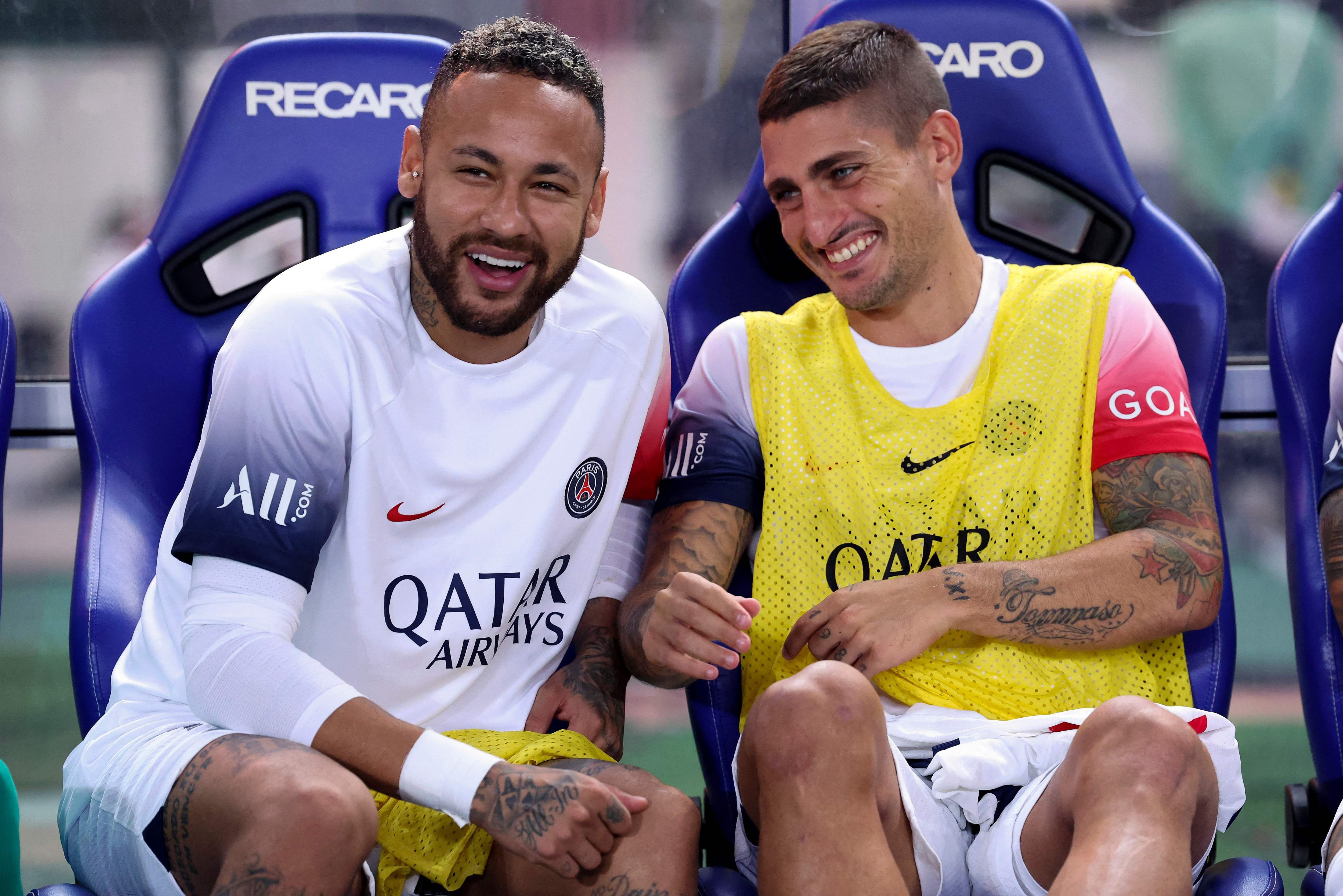 Paris Saint-Germain's Neymar Jr (L) and Marco Verratti look on from the bench before the friendly football match between France's Paris Saint-Germain and Japan's Cerezo Osaka at Nagai Stadium in Osaka on July 28, 2023. (Photo by PAUL MILLER / AFP)