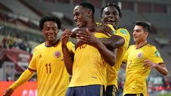 LIMA, PERU - JUNE 03: Yerry Mina of Colombia celebrates with teammates Duv&aacute;n Zapata and Juan Cuadrado (L) after scoring the first goal of his team during a match between Peru and Colombia as part of South American Qualifiers for Qatar 2022 at Estad