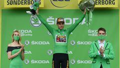 Cycling - Tour de France - Stage 3 - Vejle to Sonderborg - Denmark - July 3, 2022 Jumbo - Visma's Wout Van Aert celebrates on the podium wearing the green jersey after stage 3 REUTERS/Annegret Hilse