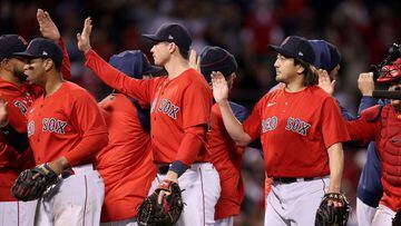 BOSTON, MASSACHUSETTS - OCTOBER 18: Hirokazu Sawamura #19 of the Boston Red Sox shake hands with teammates after they beat the Houston Astros in Game Three of the American League Championship Series at Fenway Park on October 18, 2021 in Boston, Massachuse