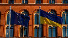 The flags of (from L) the European Union, the Ukraine, and Germany, fly in front of Berlin&#039;s city hall on March 7, 2022. (Photo by John MACDOUGALL / AFP)