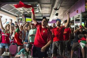 Fans react after Portugal scored against France in the Euro 2016 final soccer match in Toronto