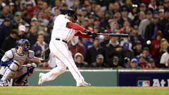 BOSTON, MA - OCTOBER 23: Rafael Devers #11 of the Boston Red Sox hits an RBI single during the fifth inning against the Los Angeles Dodgers in Game One of the 2018 World Series at Fenway Park on October 23, 2018 in Boston, Massachusetts.   Maddie Meyer/Ge