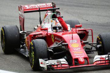 Scuderia Ferrari's German driver Sebastian Vettel celebrates placing third in the Italian Formula One Grand Prix at the Autodromo Nazionale circuit in Monza on September 4, 2016.  