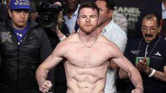 (FILES) In this file photo taken on May 05, 2017 Boxer Saul &quot;Canelo&quot; Alvarez poses on the scales during his weigh-in with Julio Cesar Chavez, Jr. at the MGM Grand Arena in Las Vegas, Nevada. - Saul &quot;Canelo&quot; Alvarez bids to extend his dominance of the middleweight division here May 4, 2019, when he takes on Daniel Jacobs in an eagerly anticipated unification bout. Mexican icon Alvarez is putting his World Boxing Association and World Boxing Council titles on the line when he faces Jacobs at the T-Mobile Arena aiming to claim the American&#039;s International Boxing Federation belt. (Photo by JOHN GURZINSKI / AFP)