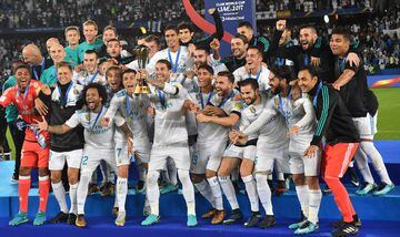 Real Madrid players celebrate with the FIFA Club World Cup trophy following their victory in the final football match against Gremio