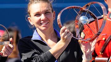 Aug 14, 2022; Toronto, ON, Canada; Simona Halep (ROU) poses with the National Bank Open trophy after defeating Beatriz Haddad Maia (not pictured)  in the women's final of the National Bank Open at Sobeys Stadium. Mandatory Credit: John E. Sokolowski-USA TODAY Sports