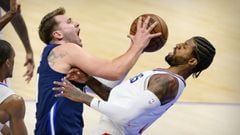 May 28, 2021; Dallas, Texas, USA; Dallas Mavericks guard Luka Doncic (77) is fouled by LA Clippers guard Paul George (13) during the second quarter in game three in the first round of the 2021 NBA Playoffs at American Airlines Center. Mandatory Credit: Je