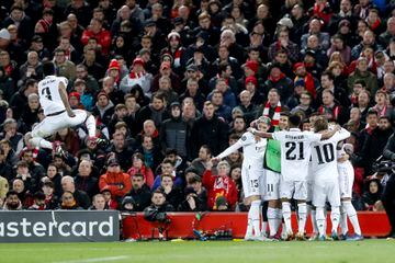 Real Madrid celebrate scoring 5 goals at Anfield in the Champions League.